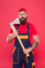 Danger concept. Renovation concept. Bearded handyman. Brave worker. Cutting beard. Brutality and...