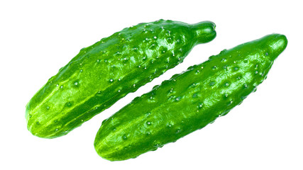 Green cucumbers on a white background isolate