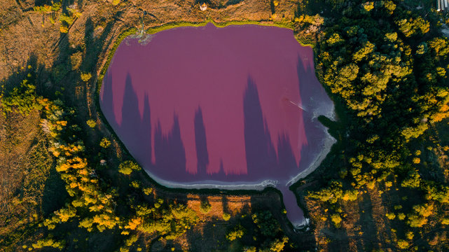 pink chemical lakes with a narrow path in-between