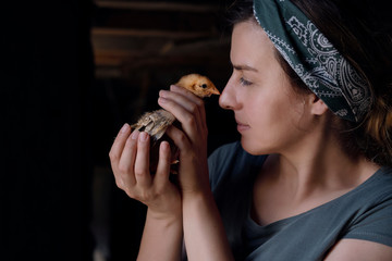 Woman and baby chicken