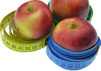 red apple with measuring tape isolated on white background