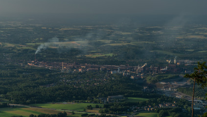 Evening over factory in Trinec town in summer hot evening