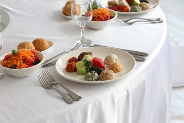 salad and hors d'oeuvres on the table