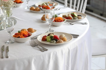 salad and hors d'oeuvres on the table
