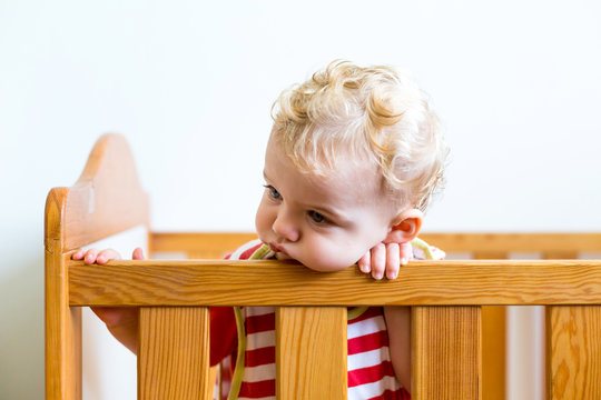 Blond child in crib