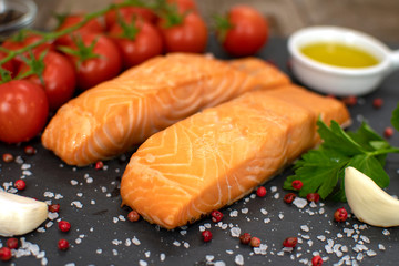 Cooked salmon fish fillets with spices, selective focus