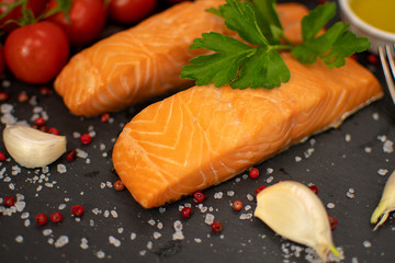 Cooked salmon fish fillets with spices, selective focus