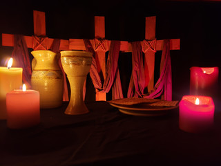 Holy Week With Communion Set and Candles on Black table