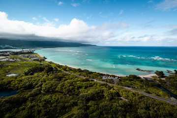 Hawaiian Island Beach Scene Aerial Landscape View of Beautiful Tropical Island Paradise with Clear Aqua Blue Water, Green Forest, and White Sand Beach on Perfect Clear Sunny Day in Maui Hawaii