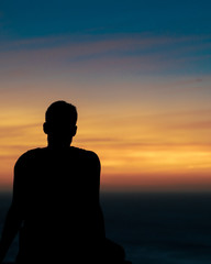 silhouette of man at sunset