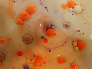 Abstract photography. Multicolored spheres, streaks and spots on a light background. Red, yellow,...