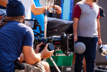 Focus puller hold the wireless follow focus system during the filming process...