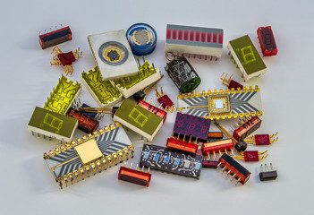 A photograph of a bunch of old electronic parts on a white background