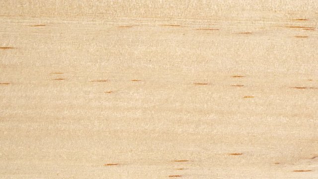 Wooden board surface tracking. Wood texture close up. Wooden background. Slider shot, top view. 4K, 422 10 bit