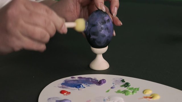 painting eggs for Easter. Painting with a sponge and different colors. preparation Spaceballs