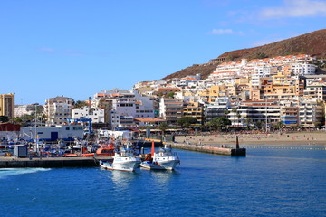 Fototapeta na wymiar Town and port of Los Cristianos of the southern part of Tenerife in the Spanish Canary Islands