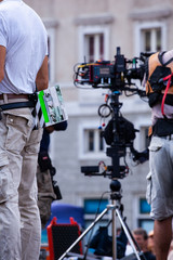 Film crew team filming movie scene on outdoor location