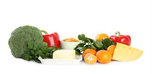 Fresh products rich in vitamin A on white background