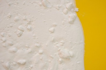 Baking soda (Sodium bicarbonate) .Baking soda on a  yellow background. Ingredient for baking. Health and cleanliness. Bio Cleanser.top view, copy space.