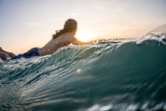 Mid twenties man surfing near Punta de Mita, Mexico