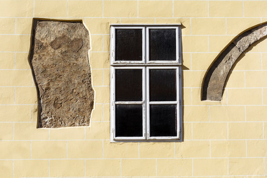 Wall and a window of an old building in the old town of Budapest.