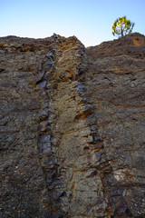 Geological formation with lava colums after magma eruption from stratovolcano