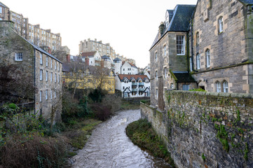 View on old houses in Dean village in New Town part of Edinburgh city, capital of Scotland, in sunny winter day