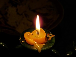 Single burning candle