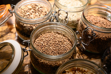 Tastes of gin, botanicals ingredients for gin distillery process, dried orange peels, juniper berries, heather, angelica, coriander, clove, cassia, liquorice