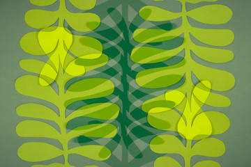 Paper green leaves of different colors. Multiple exposure. Creative background eco-friendly layout.