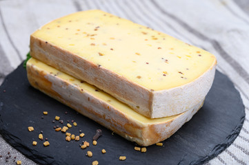 Belgian cheeses from abbey made from cow milk with monks beer, fenugreek and mustard seeds