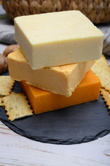 Leicestershire cheese or red leicester and mature cheddar, variety of British hard cheeses made from cow milk