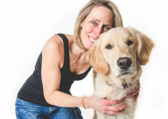 Nice woman and her beautiful Golden Retriever dog over white background