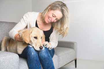 A woman with her golden Retriever dog