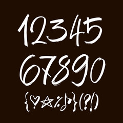 set of calligraphic acrylic or ink numbers. ABC for your design, brush lettering on a black background