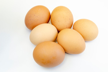 a bunch of fresh chicken eggs on a white background