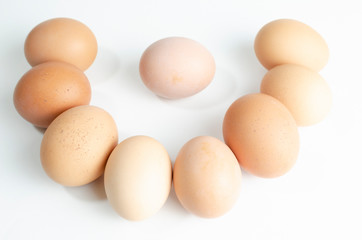 group of fresh brown chicken eggs on a white background