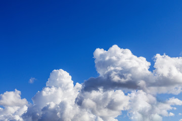 Naklejka na ściany i meble Blue sky background with white clouds Abstract background