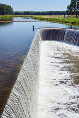 Water threshold on a river in Champagne, France.