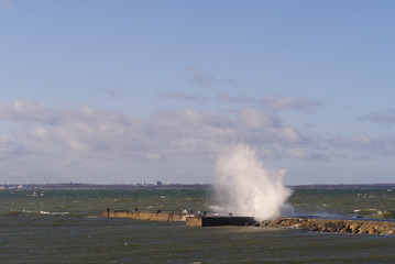 Fototapeta na wymiar Storm at baltic sea. big waves over berth