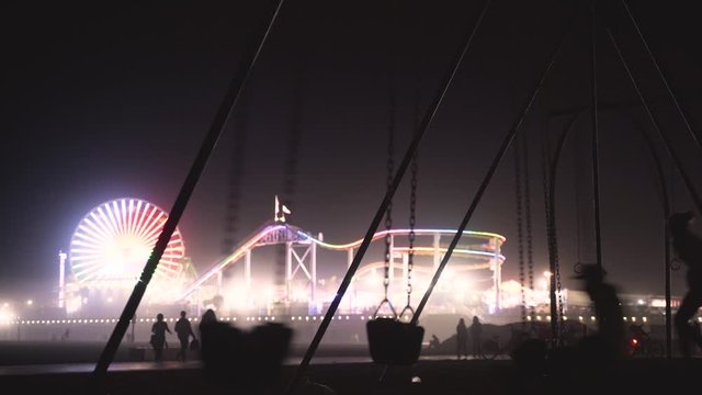 Silhouettes against circus lights.