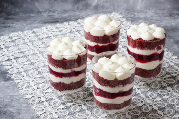 Red biscuit with raspberry jelly, cream and fresh raspberries.