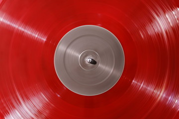Red vinyl record rotate. Ray of light piece of vinyl. Turntable player. Sound technology for DJ to...