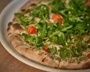 Vegan pizza with fresh arugula