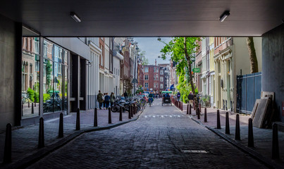 Amazing view of alley underneath the houses in Amsterdam Netherlands