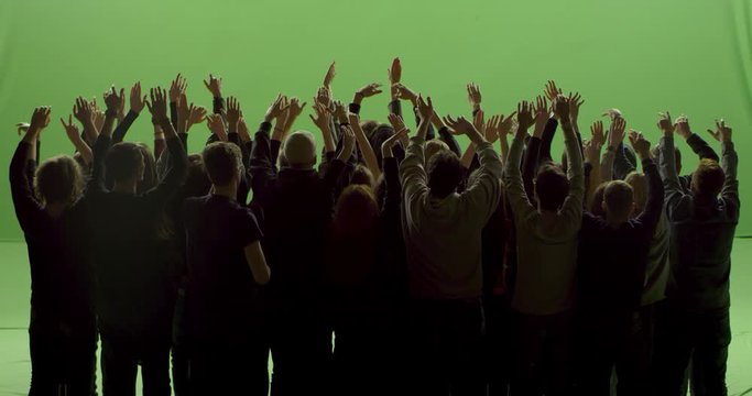 GREEN SCREEN CHROMA KEY Model released, back view of huge crowd dancing and cheering at a concert or a show. Shot on RED Helium 8K in RAW