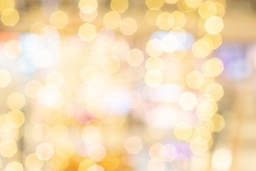 Obraz premium Gold light blur. Abstract Festive glitter Bokeh background. Soft yellow christmas backdrop.