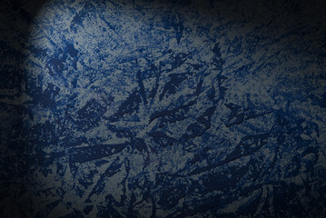 Blue wall texture or background close up. dark wall with soft lighting