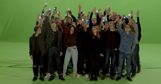 GREEN SCREEN Front view huge crowd of people with phones in hands at live concert or show. Shot on RED Helium 8K, Prores 4444