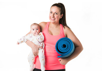 Sport motherhood and active lifestyle of young mother workout together with her baby